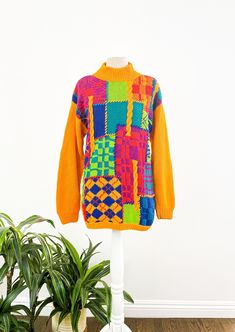 "This vintage 1980s sweater from IB Diffusion Sport brings us joy over here at Origin Vintage. With an array of bold and beautiful colors and funky patterns, it's the perfect way to brighten up a gray day. The sweater has shoulder pads that could be easily removed if desired and is in great vintage condition; structurally sound with minimal cosmetic flaws. Dare to wear!  Brand: IB Diffusion Sport Material: 55% Ramie / 45% Cotton Condition: Great vintage condition (structurally sound with minimal 80s Print Sweater, Retro Patchwork Sweater For Fall, Fall Retro Patchwork Sweater, Retro Patchwork Winter Sweater, Retro Patchwork Sweater For Winter, Oversized Multicolor Vintage Sweater, Retro Orange Long Sleeve Sweater, Orange Retro Long Sleeve Sweater, Orange Long Sleeve Retro Sweater