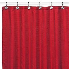 a red shower curtain hanging on a metal rod