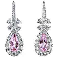 Fabulous platinum drop earrings feature pink emeralds - natural morganites just under two carats, each embedded in graduated diamond clusters. The pear-shaped pendants, diamond bows, and pave-studded French wires are connected with flexible hinges allowing the stunning chandeliers to tremble with your every step. The tender pink of the morganites in a ring of brilliant fire combined with the innocent sweetness of the diamond bow will turn your red carpet entrance into a paparazzi-infused scene. Red Carpet Entrance, Leon Mege, Beautiful Diamond Earrings, Pearl Chandelier Earrings, Diamond Chandelier Earrings, Titanic Jewelry, Diamond Chandelier, Pear Shaped Pendant, White Diamond Earrings