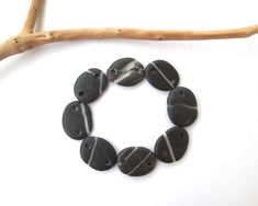 Great selection of side drilled, medium size, quartz striped black beach stone jewelry making links from the Mediterranean... There are 8 rock connectors, They are in bw: 17-19 mm at their widest. Hole size: 2.5 mm. ★ Ready to ship via Registered Express Airmail.  You can UPGRADE to UPS (delivery in 3-4 days) with a good price! ★ For more thrilling beach stone, pebble, rock jewelry making supplies  StoneAlone.etsy.com 5846 Black Natural Stones Jewelry For Beach, Beach Stones Jewelry, Eco Jewelry, Black Beach, Rock Jewelry, White River, Beach Stones, River Rock, Jewelry Making Supplies