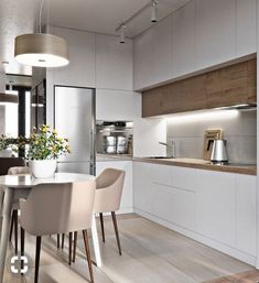 a dining room table and chairs in a kitchen