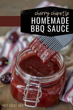 cherry chipotle homemade bbq sauce in a mason jar with a spatula