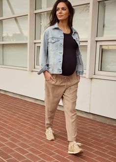 The ‘it girl’ pants of your pregnancy. Woven together in a lightweight fabric, these drapey ankle pants feature a tapered silhouette, oversized pockets, and an adjustable stretchy waistband to grow with you, trimester to trimester. Size down for a less slouchy look! 92% rayon / 8% polyester Machine wash cold with like colors. Do not bleach. Tumble dry low. Iron low heat. Ideal for second and third trimester Inseam: 27” Bianca is 5’9”, 33 weeks pregnant, and wearing size S To wear with anything y Maternity Pants With Elastic Waistband, Casual Maternity Pants With Relaxed Fit, Casual Relaxed Fit Maternity Pants, Casual Maternity Pants With Elastic Waistband, Casual Relaxed Fit Maternity Bottoms, Casual Relaxed Fit Bump Friendly Bottoms, Casual Maternity Bottoms For Spring, Spring Casual Maternity Bottoms, Casual Spring Maternity Bottoms