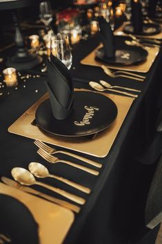 black and gold table setting with place settings