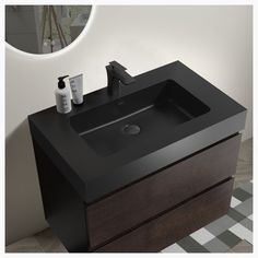 a bathroom sink sitting on top of a wooden cabinet