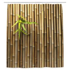 a bamboo wall with a green plant growing out of the top right corner and bottom left corner