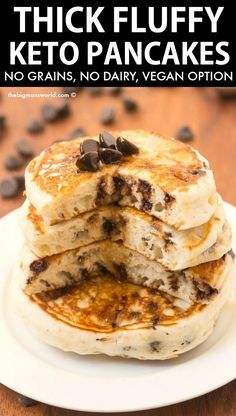 stack of fluffy keto pancakes on a white plate with chocolate chips in the background