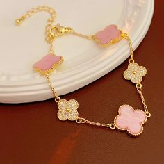 The Arabella Clover Bracelet is the perfect combination of playfulness and charm. Adorned with delicate pink and stone-encrusted clovers, this dainty bracelet captures a sense of whimsy with just the right amount of sparkle. Each clover brings its own unique shimmer, crafted to catch light at every angle, creating a soft yet eye-catching look on your wrist. This bracelet is made from durable stainless steel with a beautiful 18K gold plating, offering both strength and beauty that withstands dail Mismatched Earrings Studs, Pink Clover, Clover Bracelet, Clover Flower, Lucky Bracelet, Geometric Heart, Basic Jewelry, Clover Charm, Crystal Hoop Earrings