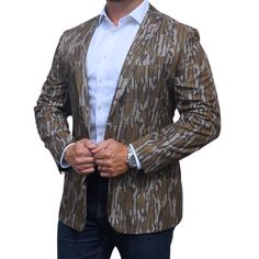 IT IS FINALLY HERE! Elevate your style with the Mossy Oak Original Bottomland Perfect Pattern Sportcoat. This mid-weight camo blazer features a high-quality fabric with the Mossy Oak pattern, Original Bottomland, perfect for any occasion from business to formal events. Designed with attention to detail and high-end finishes, this sportcoat is sure to become a staple in your wardrobe. Dress it up or down and stand out in any setting. Perfect for any outdoorsman looking to make a statement. Features: Two Button Notch Lapel Double Rear Vent Modern Fit Made with a mid-weight, Silky 100% spun Polyester Official Licensed Product of Haas Outdoors, Inc., West Point, MS 39773.Distributed by Perfect Pattern Sportcoats LLC. Fitted Camouflage Military Outerwear, West Point, Mossy Oak, Black Tie Event, Sport Coat, Modern Fit, Black Tie, Formal Event, Business Casual