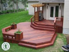 a large wooden deck in front of a house