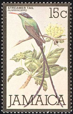 a postage stamp with a bird on a tree branch and flowers in the foreground