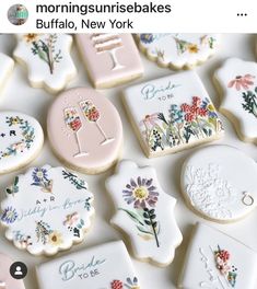 decorated cookies are arranged on a table