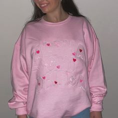 This baby pink or sand crewneck will have your sorority spelled out in a full front embroidered design surrounded with hearts (& love!), just pick your size, color and sorority and we will take care of the rest! <3 ***Due to nationwide stock shortages, we have several different manufacturers for our pink crews. The color, weight, and specs are similar on all of them. *Model is wearing a size XL for an oversized fit Size Chart: Pink Embroidered College Sweatshirt, Personalized Pink Casual Sweatshirt, Personalized Pink Crew Neck Sweatshirt, Pink Crew Neck Sweatshirt For School Spirit, Surrounded By Love, Pink Crewneck, Embroidered Design, Sorority, Baby Pink