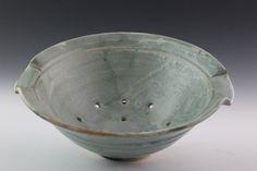 a bowl that has holes in the bottom