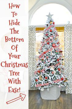 a white christmas tree with candy canes and stars on it in front of a window