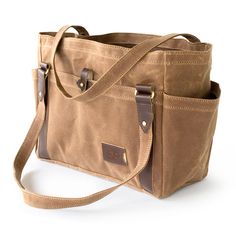 DESCRIPTION "I love all the pockets and space this personalized tote bag has to offer. The waxed canvas is beautiful and has an old world feel! I enjoy it and use it often either around town or traveling the world!" Often purchased as a diaper bag because of its multiple pockets, generous main compartment, and spill-resistant interior and exterior. Functional Design A sturdy and spacious body, a handsome and personalizable built-in luggage tag, and a variety of interior and exterior pockets add Waxed Canvas Tote Bag, Tote Bag With Pockets, Bag With Pockets, Large Handbags Tote, Handbag Large, Cotton Handbag, Carryall Tote, Leather Key Fobs, Letter Monogram