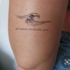 a woman's leg with a tattoo saying all waves eventually pass