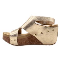 PRICES MAY VARY. Faux leather or metallic faux leather upper with metal buckle closure and studd accents Synthetic lining Signature ultra comfort EVA insole Cork 2.75” wedge with rubber traction outsole Volatile Shoes, Athletic Sandals, Sandals Casual, Pool Side, Ankle Strap Wedges, 4 Inch Heels, Casual Sandals, Wedge Sandal, Mid Heel