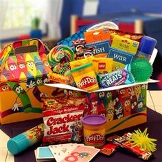 a box filled with candy and snacks on top of a table