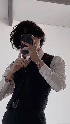 a person taking a selfie in front of a mirror