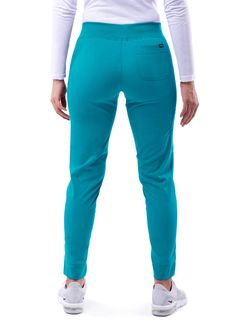 FEATURES: Super Soft Stretch Fabric Wrinkle-Resistant Odor Resistant Easy Care PRODUCT DESCRIPTION: This Ultimate Yoga Jogger by Adar is the perfect pant to take you from working in a chilly medical setting to running errands. It is in a league of its own with super soft stretch fabric, order/wrinkle-resistant fabric, and a duel hem. Our duel hem features a trouser hem in the front and adds a pinch of style with a classic jogger fit hem in the back. These comfortable scrub pants sit right below Blue Non-stretch Pants With Side Pockets, Blue Full-length Pull-on Pants, Blue Full Length Pants With Pull-on Style, Blue Stretch Bottoms With Side Pockets, Blue Non-stretch Pull-on Bottoms, Turquoise Stretch Bottoms, Stretch Blue Bottoms With Comfort Waistband, Blue Stretch Bottoms With Comfort Waistband, Blue Relaxed Fit Bottoms With Comfort Waistband