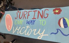 a sign that says surfing our way to victory