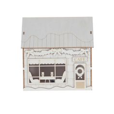 a paper model of a cafe with white walls