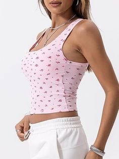 Crafted from a luxurious blend of 46% cotton, 46% rayon, and 8% spandex, this Cotton Rib Tank offers a soft touch and perfect stretch for all-day comfort. Featuring a square neck, fitted crop design, and chic contrast stitching, its double-layered breast area and removable pads provide ample support for bra-free wear. This versatile tank pairs seamlessly with yoga pants, shorts, skirts, jeans, and more, making it ideal for yoga, workouts, vacations, or casual wear. Transition easily from summer Comfortable Fitted Tank Top For Summer, Fitted Floral Print Scoop Neck Tops, Feminine Stretchy Loungewear Top, Non-stretch Seamless Summer Tops, Comfortable Seamless Cotton Tops, Comfortable Tops For Summer Loungewear, Stretch Tank Top For Spring Loungewear, Comfortable Summer Tops For Loungewear, Stretch Spring Tank Top For Loungewear