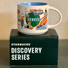 starbucks mug sitting on top of a box with the words starbucks's discovery series printed on it