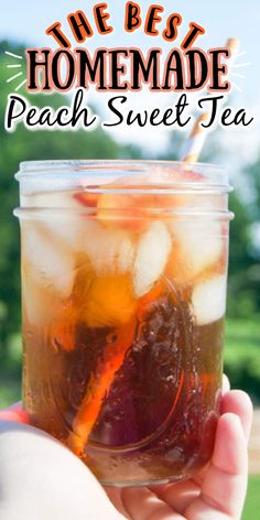 a person holding a mason jar filled with peach sweet tea and ice cubes, text overlay reads the best homemade peach sweet tea