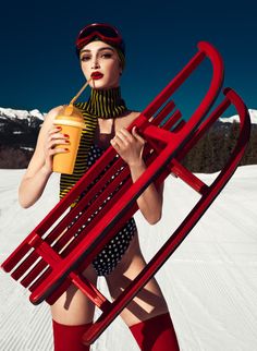 a woman in red stockings holding a yellow cup