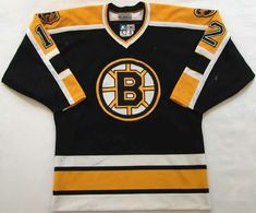 an old hockey jersey with the boston logo on it