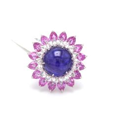 Designer Colorstone Jewelry by Jewelove Gemstone : Tanzanite, Pink Sapphire & Rose Cut Diamonds Carat Weight of Tanzanite : 15.63 cts. Carat Weight of Pink Sapphire : 5.83 cts. Carat Weight of Rose Cut Diamonds : 1.45 Cts. Metal : 18K White Gold Gold Purity : 18K Purity Mark : 18K Gross Weight : 10.16 grams Certificate of Authenticity : SGL / Veega Gem Lab P.S. : This ring has been sold. Please call us at +91-9828012999 or email at WeCare@Jewelove.in to inqure about similar emeralds. Round Multi-stone Sapphire Ring, Pink Round Gemstones With Prong Setting, Pink Sapphire Round Gemstones For Gifts, Round Pink Sapphire Gemstones For Gift, Pink Sapphire Gemstones Gift Round Shape, Pink Sapphire Gemstones As A Gift, Formal Gemstone Flower Ring, Multi-stone Tanzanite Round Ring, Hallmarked Pink Sapphire Round Rings