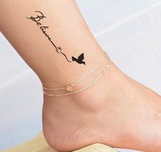 a person with a tattoo on their foot and the word love is written in cursive writing