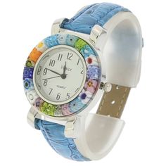 A unique timepiece for every season and mood, this Murano Glass watch will remind you of Venice every minute of every day. With beautiful colors splattered around the dial on the handcrafted Millefiori bezel, this wonderful watch showcases the time-honored Murano glass-making tradition and classic Italian style that never goes out of fashion. Measurements: The face of this Murano glass watch measures 7/8 inch in diameter. The entire case measures 1-3/8 inches in diameter. The watch features silv Classic Italian Style, Seattle Fashion, Italian Leather Handbags, Murano Glass Jewelry, Italian Bags, Glass Making, Handmade Handbags, Christmas Figurines, Classic Italian