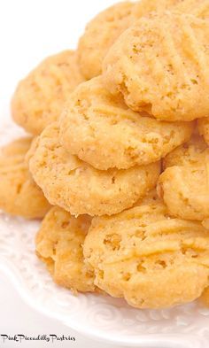 a pile of cookies sitting on top of a white plate