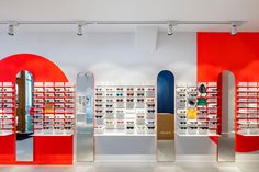 the inside of a store with red and white walls