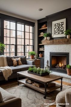 Cozy farmhouse living room with a gray sofa, wooden coffee table, white brick fireplace, and shelves adorned with potted plants and décor. Joanna Gaines Design Living Room, Traditional Farmhouse Interior Design, Colonial Farmhouse Living Room, Joanna Gaines Farmhouse Living Rooms, Antique Farmhouse Living Room, White Farmhouse Living Room, Joanna Gaines Living Room, Above Fireplace Decor, Modern Farmhouse Living Room Ideas