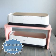 two cricut machines sitting on top of each other with the words more options available