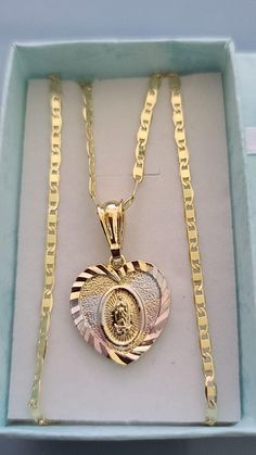 "Special for you. We offer free shipping with the purchase of 35 dollars or more! with First Class Mail (Not Priority Mail) 14k Tricolor Gold Plated Virgin Mary - Guadalupe Virgin Heart Pendant Necklace 23.5\" Virgen de Guadalupe Corazon Cadena Oro Laminado, Mother's Day, Father's Day, Valentine's Day, Christmas, Special Gift! *style chain is 24 inches long and 3.2 mm in width (CM-51) *Tri-Color Gold & Gold design *Virgin Mary Heart & Guadalupe Heart *Pendant Height: 1\" inch Material: C Quinceanera Jewelry, Xoxo Jewelry, Mexican Jewelry, Jewelry Fashion Trends, Dope Jewelry, Jewelry Lookbook, Girly Jewelry, Heart Pendant Necklace, Dream Jewelry