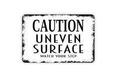 a sticker that says caution uneven surface watch your step on the back of it