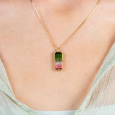 Resplendent with the juicy hues that makes this gemstone so desirable, this Watermelon Tourmaline necklace is a mouthwatering example of vivid dual coloration. This one-of-a-kind stone is displayed in handmade 18K yellow gold, accented with braided gold detail and granulated prongs. One of a kind. Technical Details Metal: 18k yellow goldTourmaline: 5.55 cts. Pendant Size (not including bail): 20 x 9mmChain: can be worn at 16" and 18"Closure: lobster claspHandmade in New YorkStyle # N-3409-TOUR Watermelon Tourmaline Necklace, Tourmaline Pendant, Tourmaline Necklace, Watermelon Tourmaline, Gold Details, Tourmaline, Watermelon, Yellow Gold, Stone