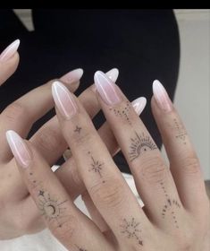 two hands with different designs on their fingers