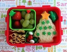 a red plastic container filled with food on top of a table