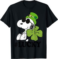 a black t - shirt with a cartoon dog wearing a green hat and shamrock clover