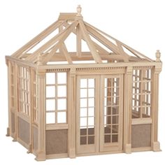 a wooden model of a house with windows