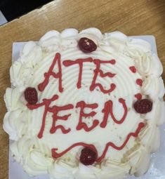 a cake with white frosting and red writing on it that says ate fem