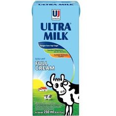 a carton of ultra milk with cows on the side and blue sky in the background