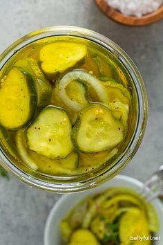 sliced cucumbers in a jar with salt and pepper