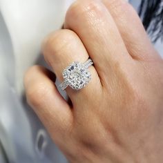 This exceptional diamond engagement features a GIA certified 3.00 Ct. Cushion cut diamond with I color grade and very clean VVS1 clarity. Matching its color and clarity are 0.70 Ct. Round cut diamonds set pave on the halo and flow down the shank in a single row. Matching Band is available by request! Metal : 14K Gold, 18K Gold or Platinum Setting Type : Prong, U-Setting Total Carat Weight : 3.70 Carats Type : Natural Diamond Shape : Cushion Cut Carat Weight : 3.00 Ct. (GIA Certified) GIA Certifi Radiant Cut Diamond Ring With Vvs Clarity, Vvs Clarity Radiant Cut Diamond Ring, Radiant Cut Diamond White Diamond Ring, Diamond White Radiant Cut Diamond Ring With Vvs Clarity, White Halo Ring Radiant Cut For Anniversary, White Radiant Cut Halo Ring For Anniversary, Gia Certified Radiant Cut Diamond Ring, Radiant Cut Diamond Ring In Diamond White, Radiant Cut Brilliant Lab Grown Diamond Ring